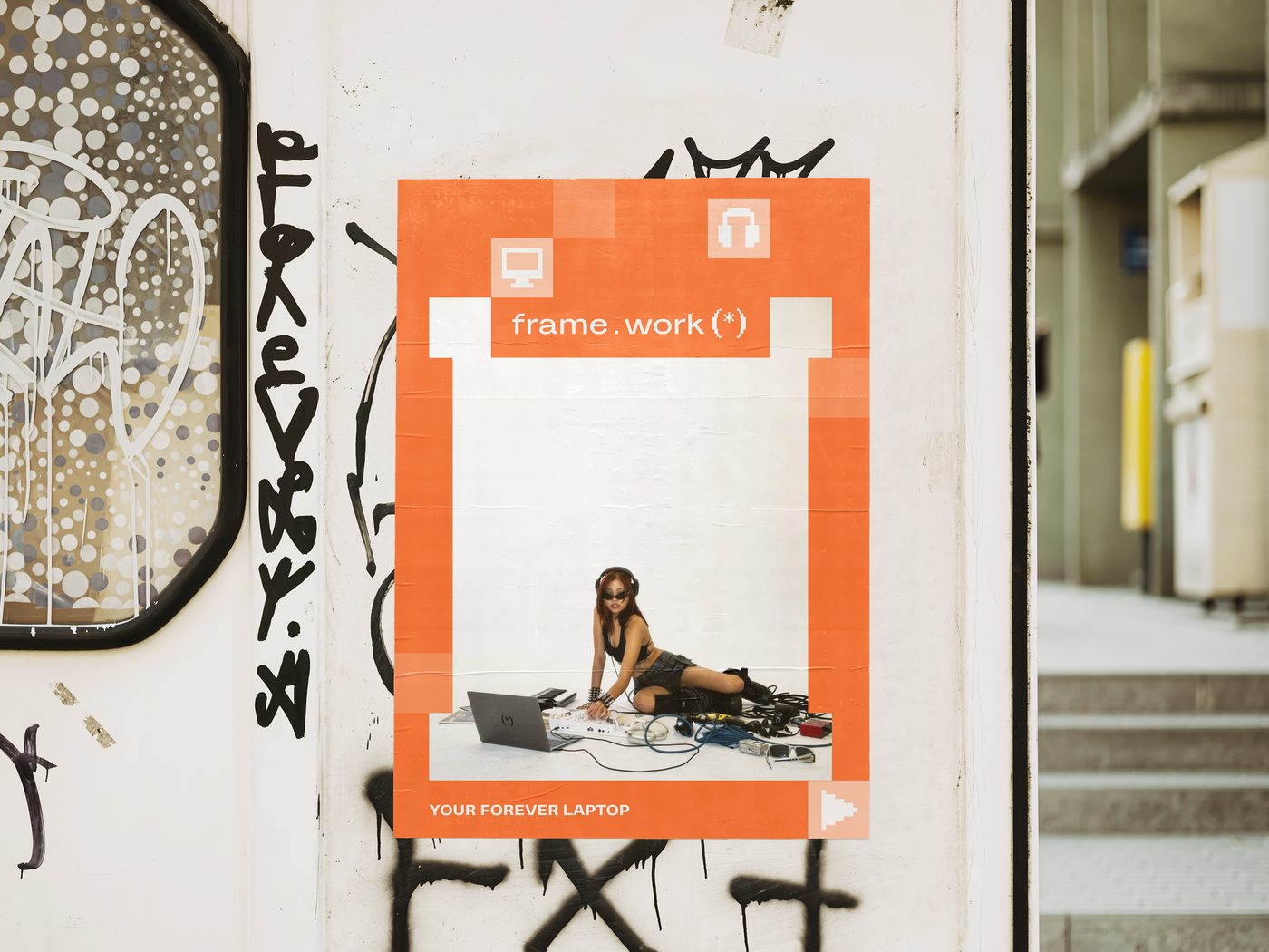 frame.work poster pasted on a graffitied city wall