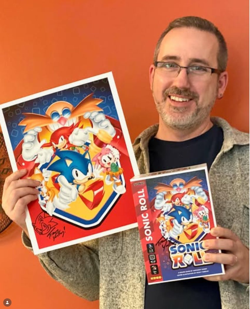 Print signed by Sonic comic artist Tracy Yardley, held up at the event