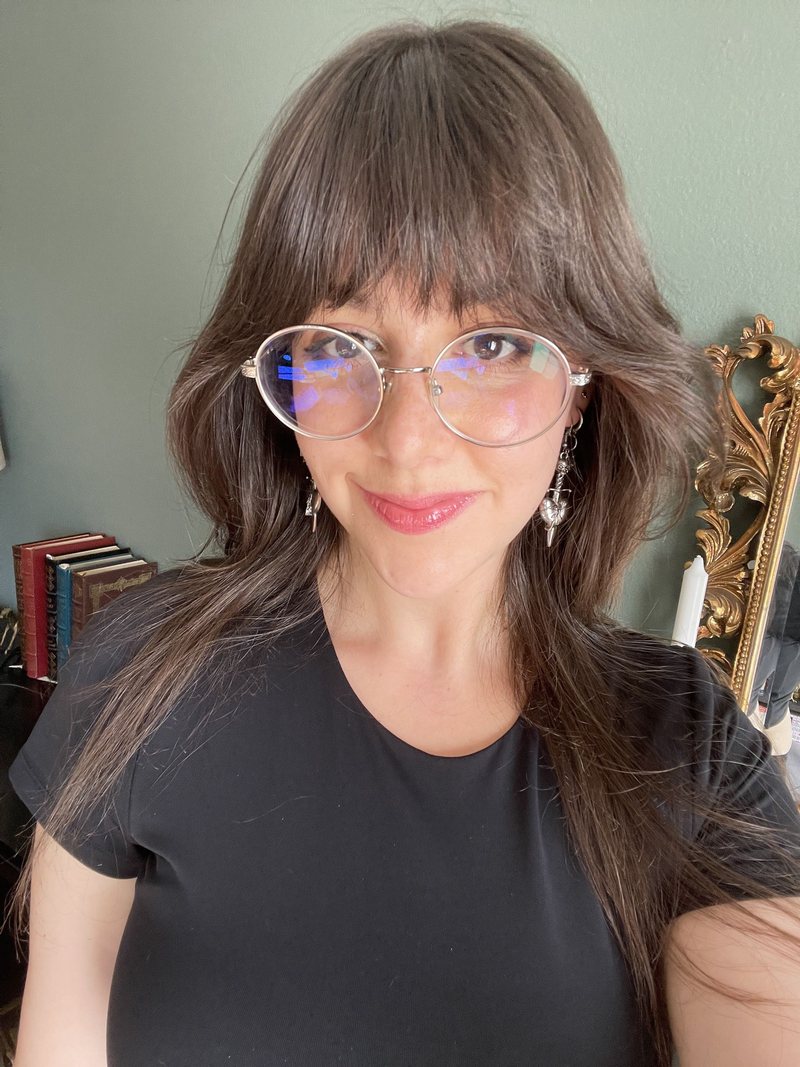 Faina Danielian smiling, wearing glasses